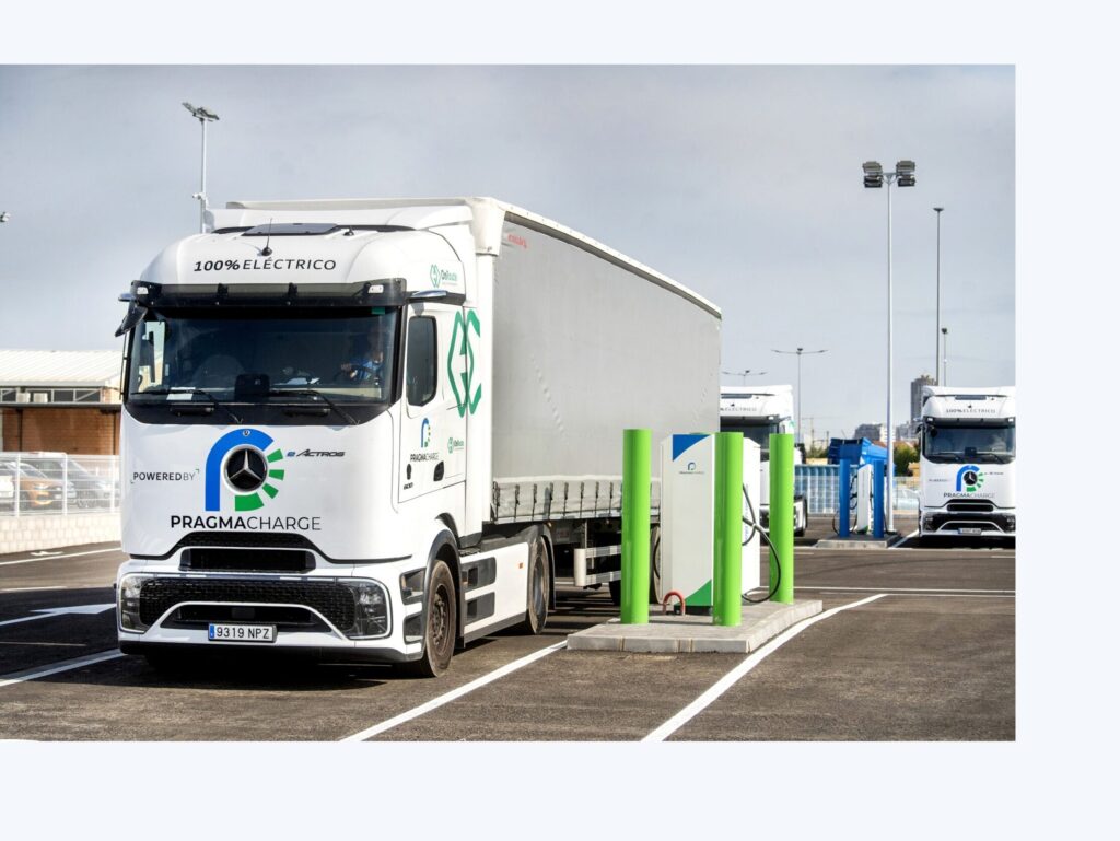 PragmaCharge heavy-truck charging hub with electric trucks at charging bays
